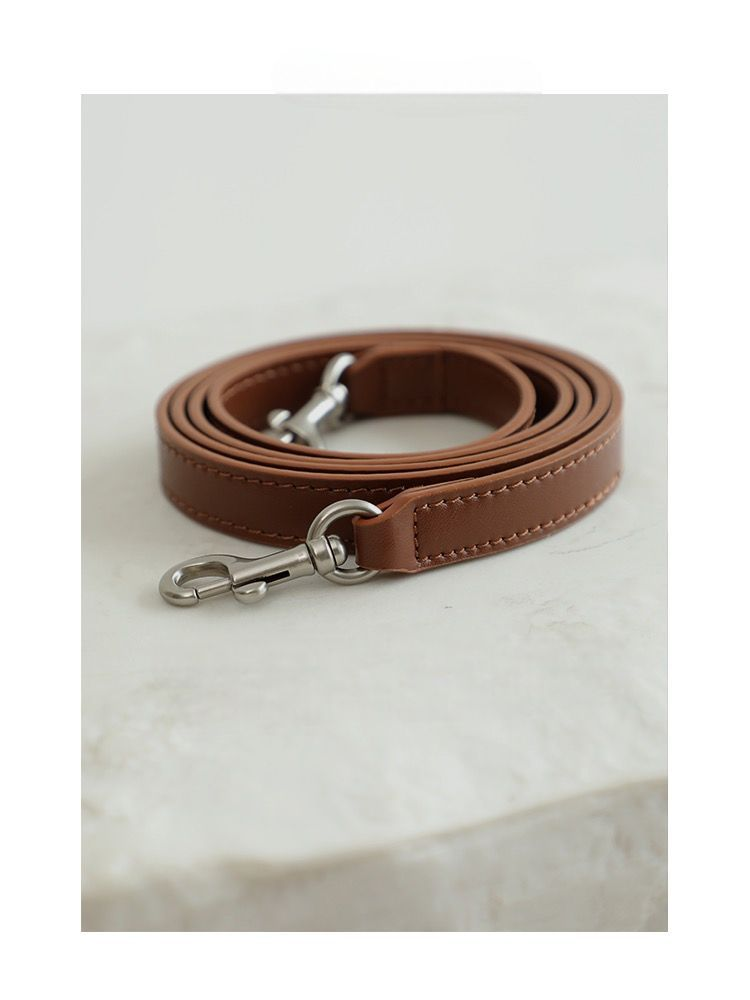 Leather shoulder strap rolled for detail view