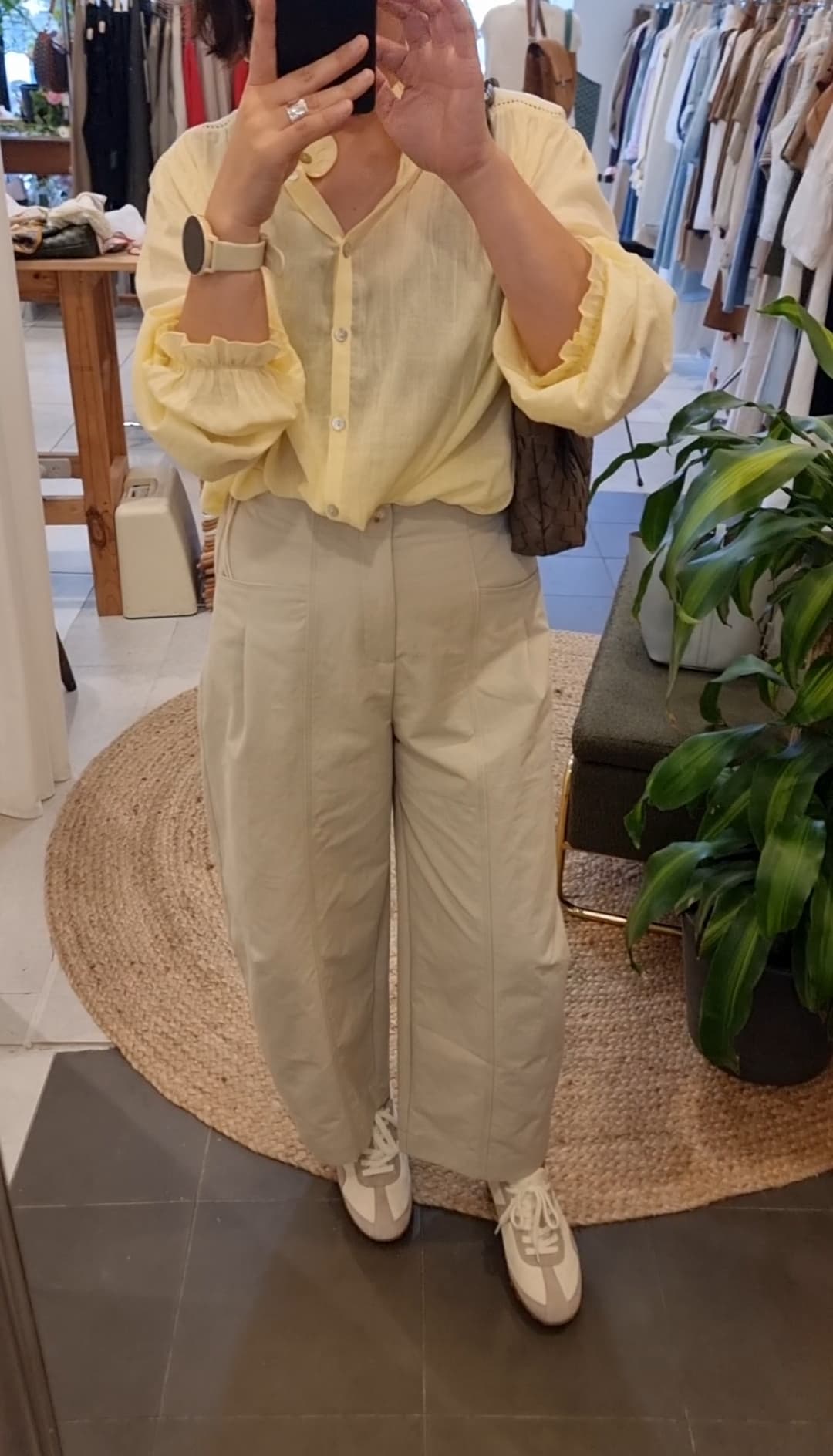 Model wearing white and grey leather fabric sneakers