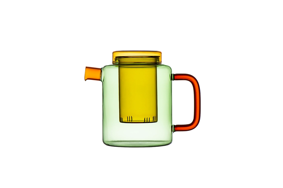 Green glass teapot with a yellow infuser and orange handle on a transparent background