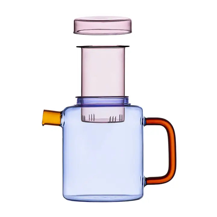 Blue glass Cha Pot with a pink infuser, amber spout, and orange handle on a white background