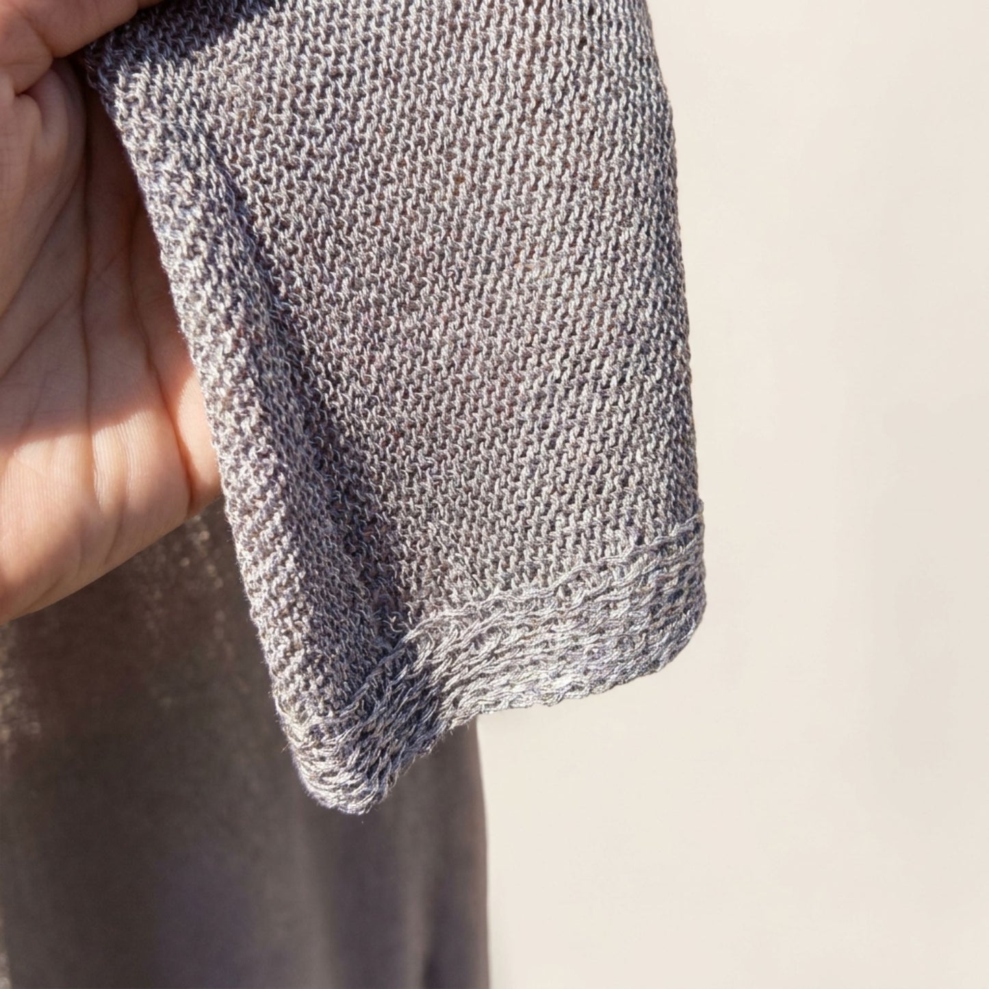 Grey linen knit fabric sleeve detail