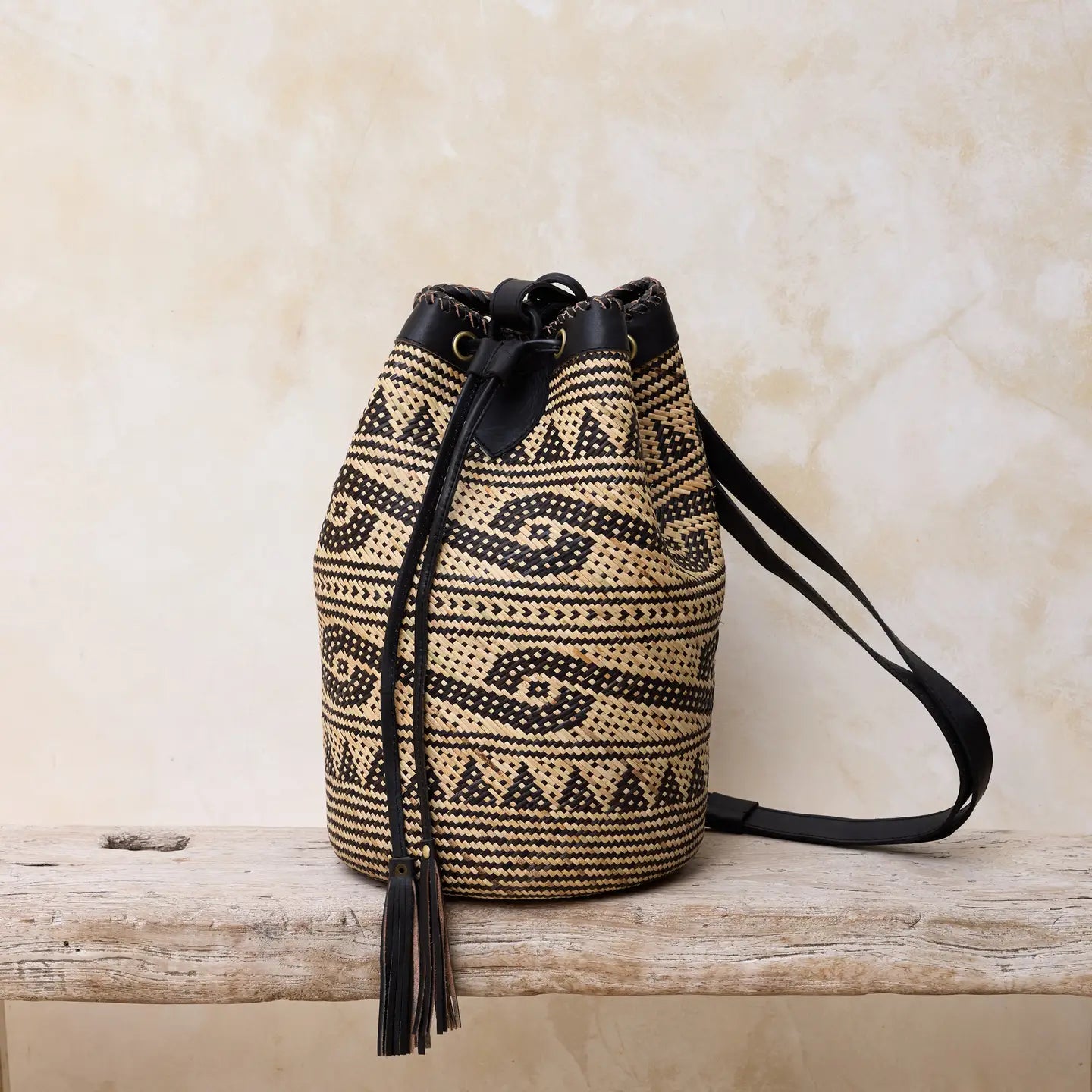 Close-up of the rattan pattern and leather details of the Borneo artisan bag.