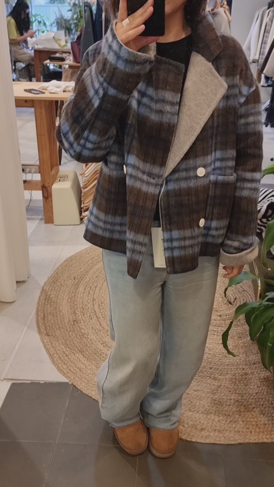 Blue plaid wool coat styled with denim jeans