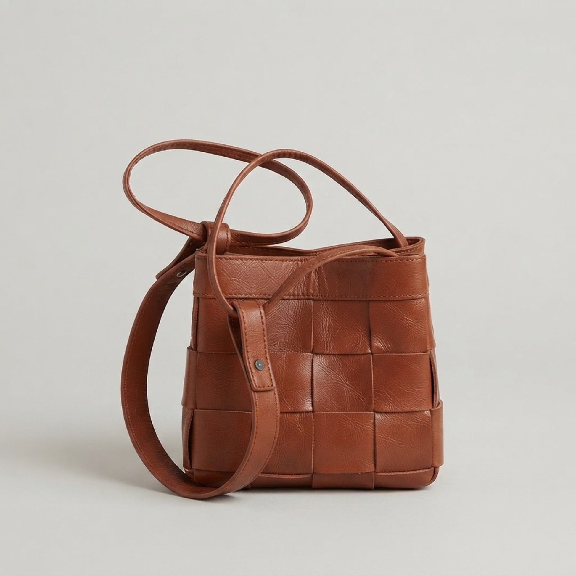 Brown woven genuine leather crossbody bag with adjustable strap by Nova Lux