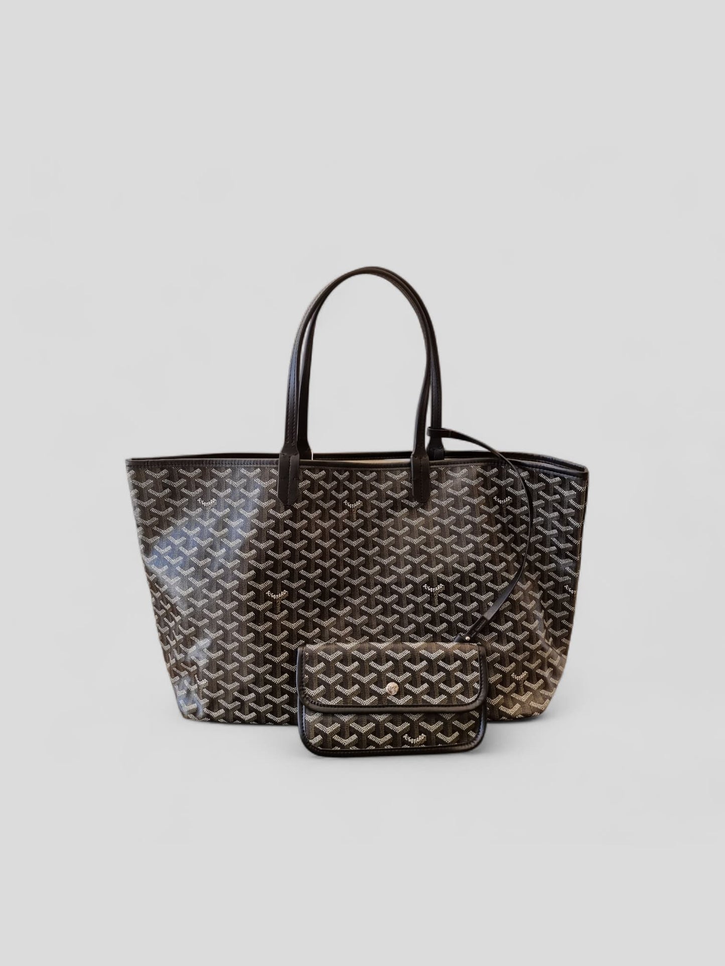 Front view of large patterned tote bag with dark handles on light background