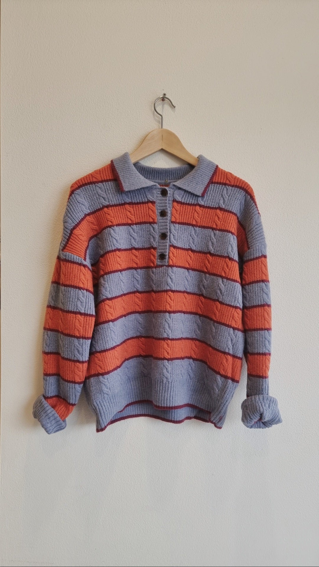 striped knit polo sweater front view on hanger