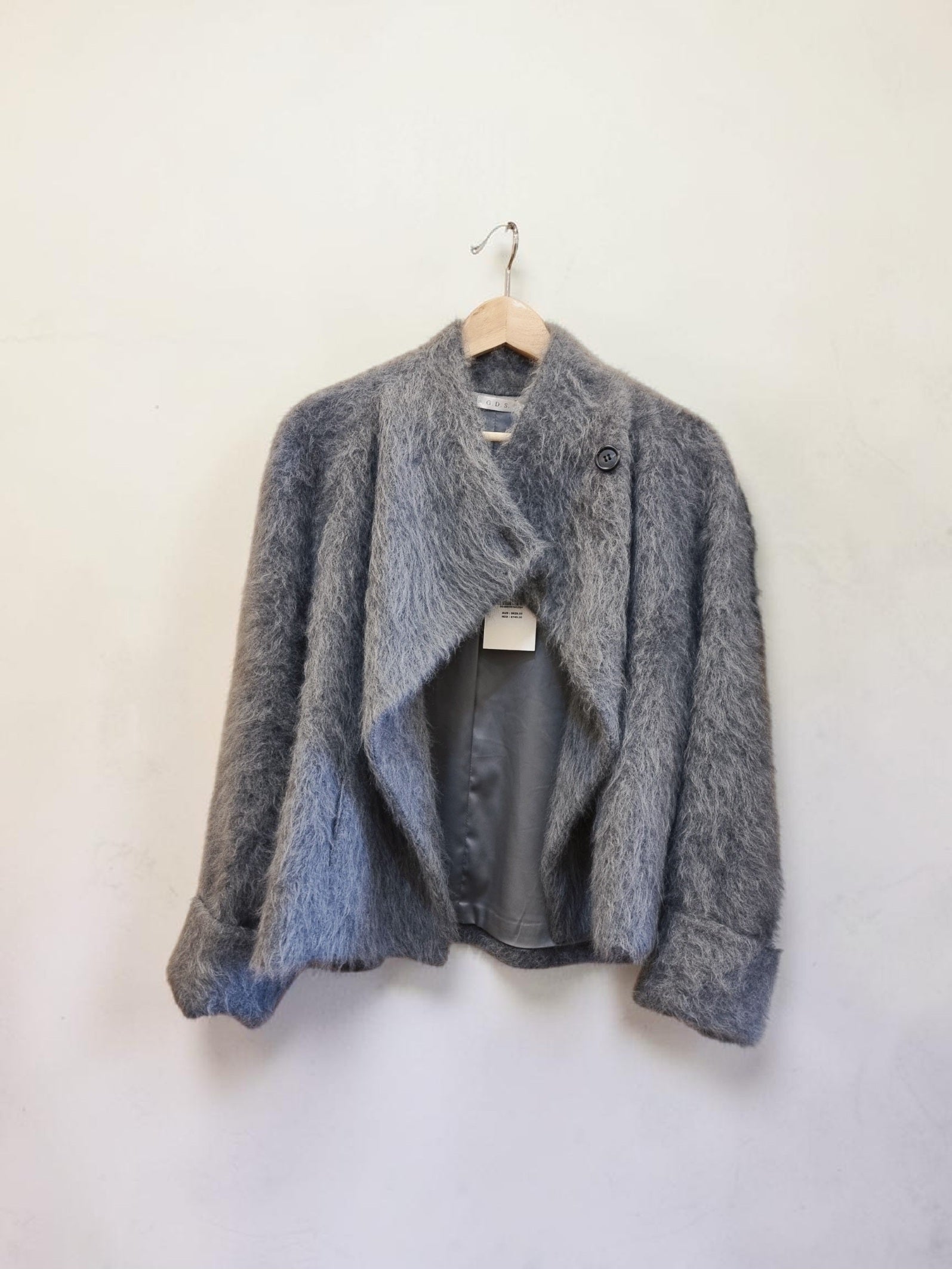 Women’s warm lined wool jacket on hanger