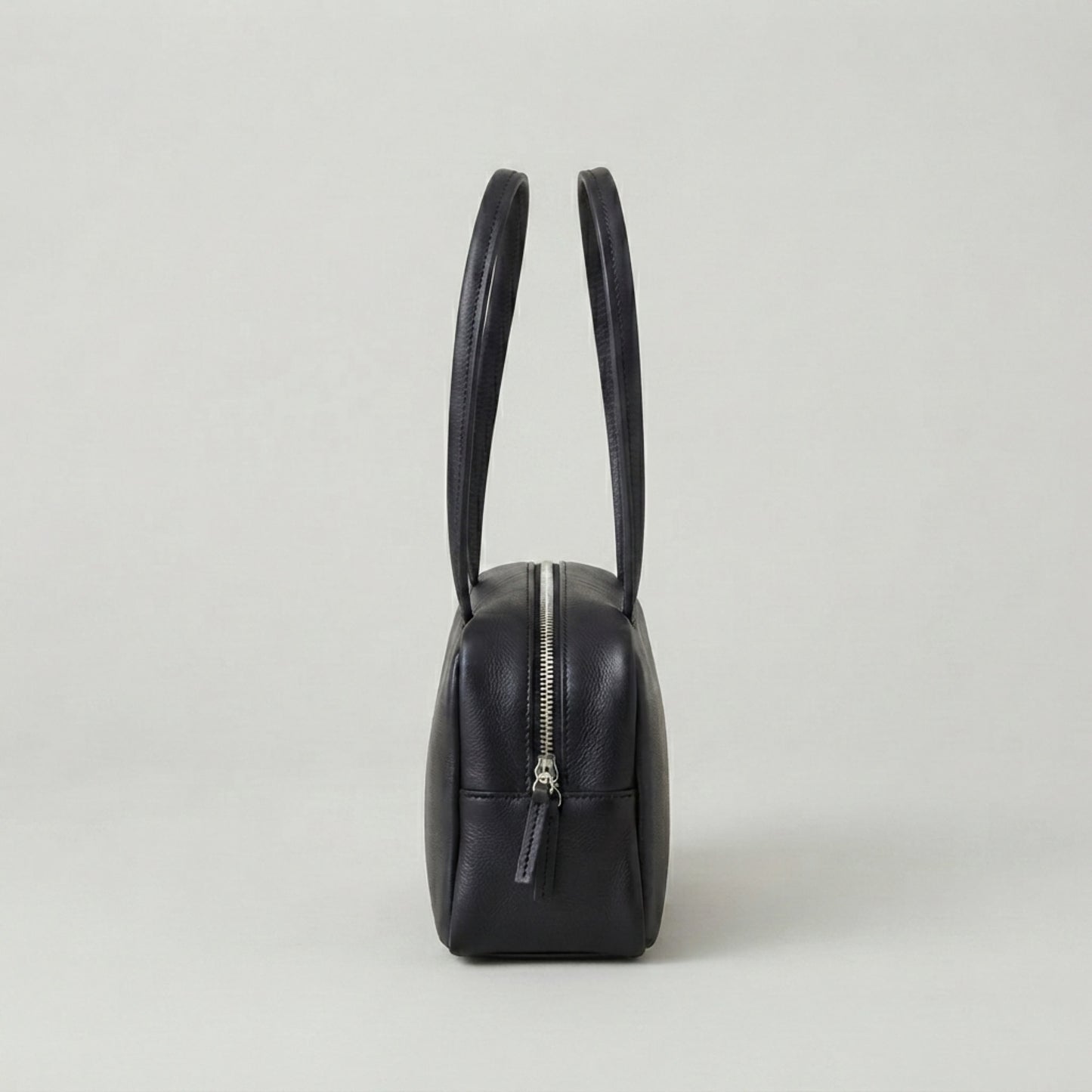Classic black leather shoulder bag with structured rectangular design
