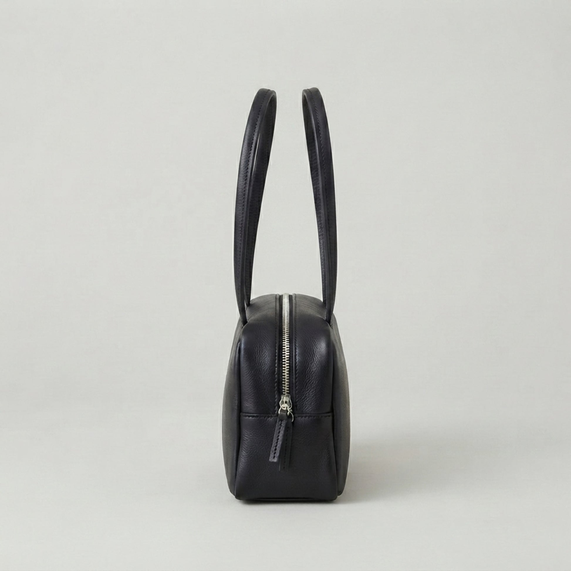 Classic black leather shoulder bag with structured rectangular design