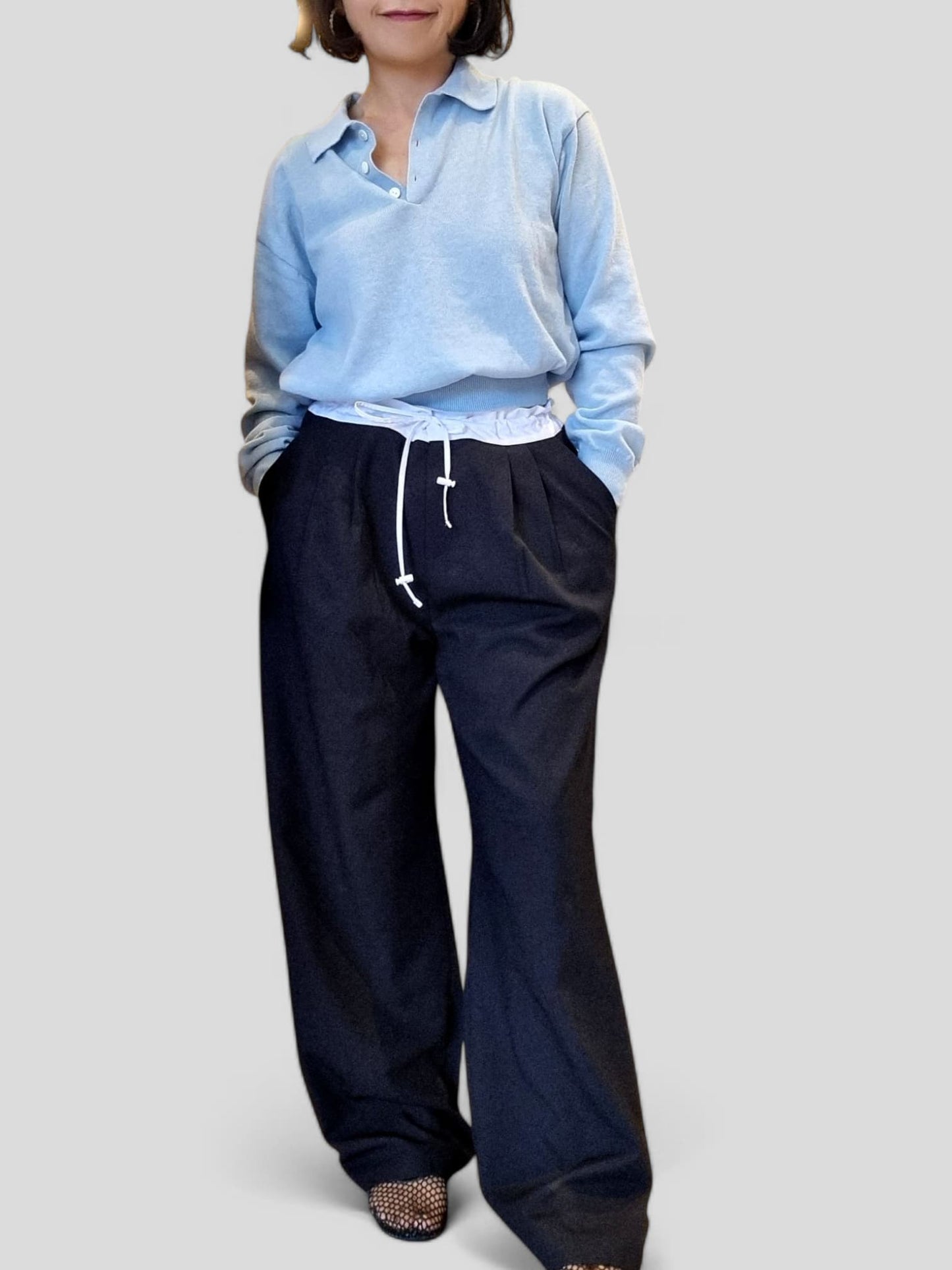 “Front view of blue cotton top styled with wide-leg pants”