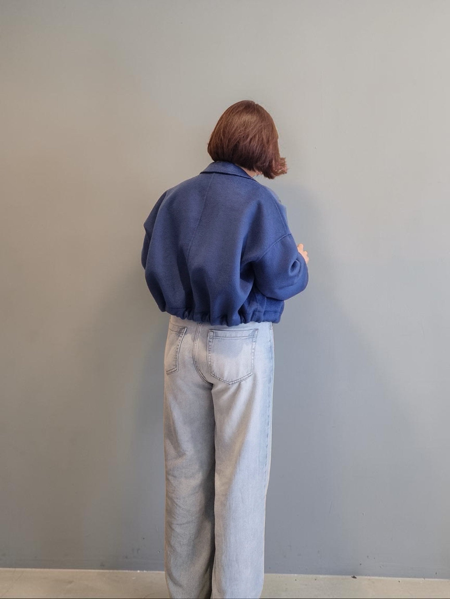 Minimalist wool jacket back view for women