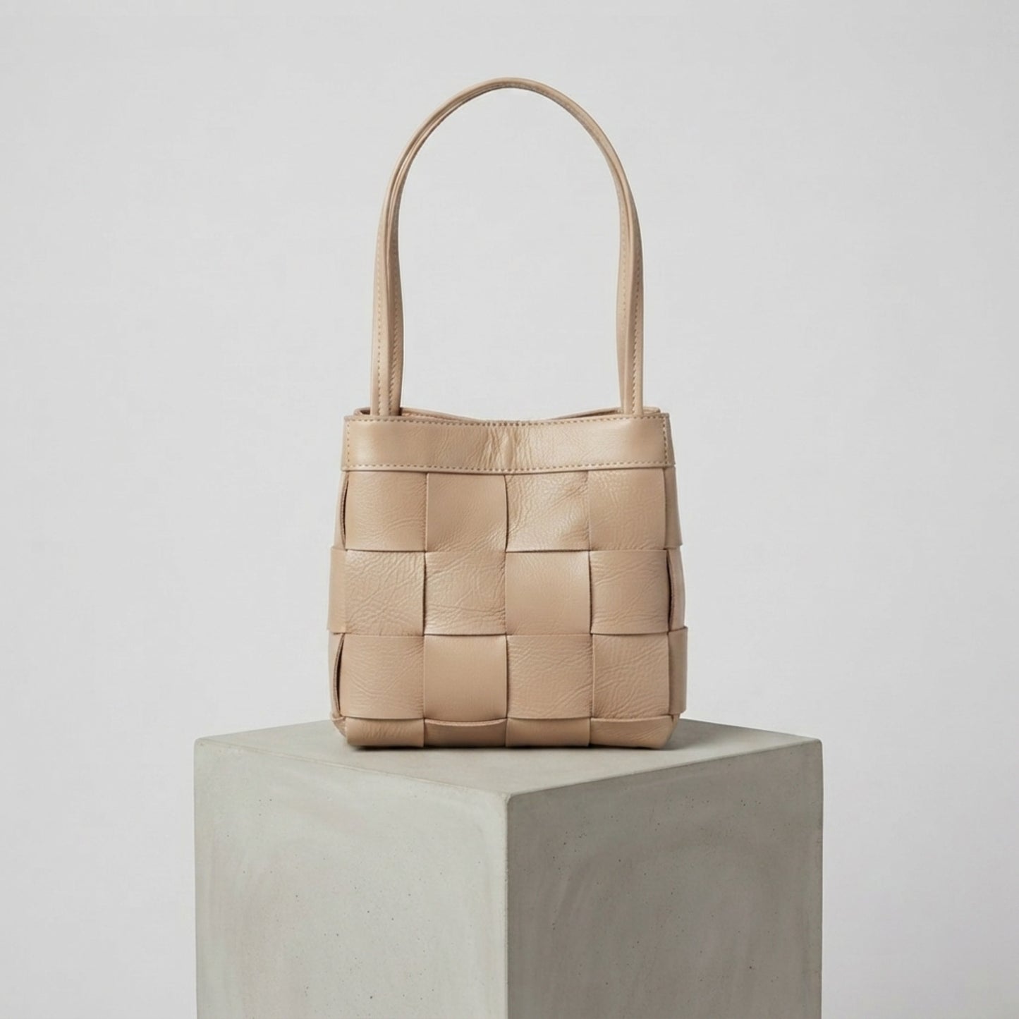 Beige woven genuine leather handbag with top handles