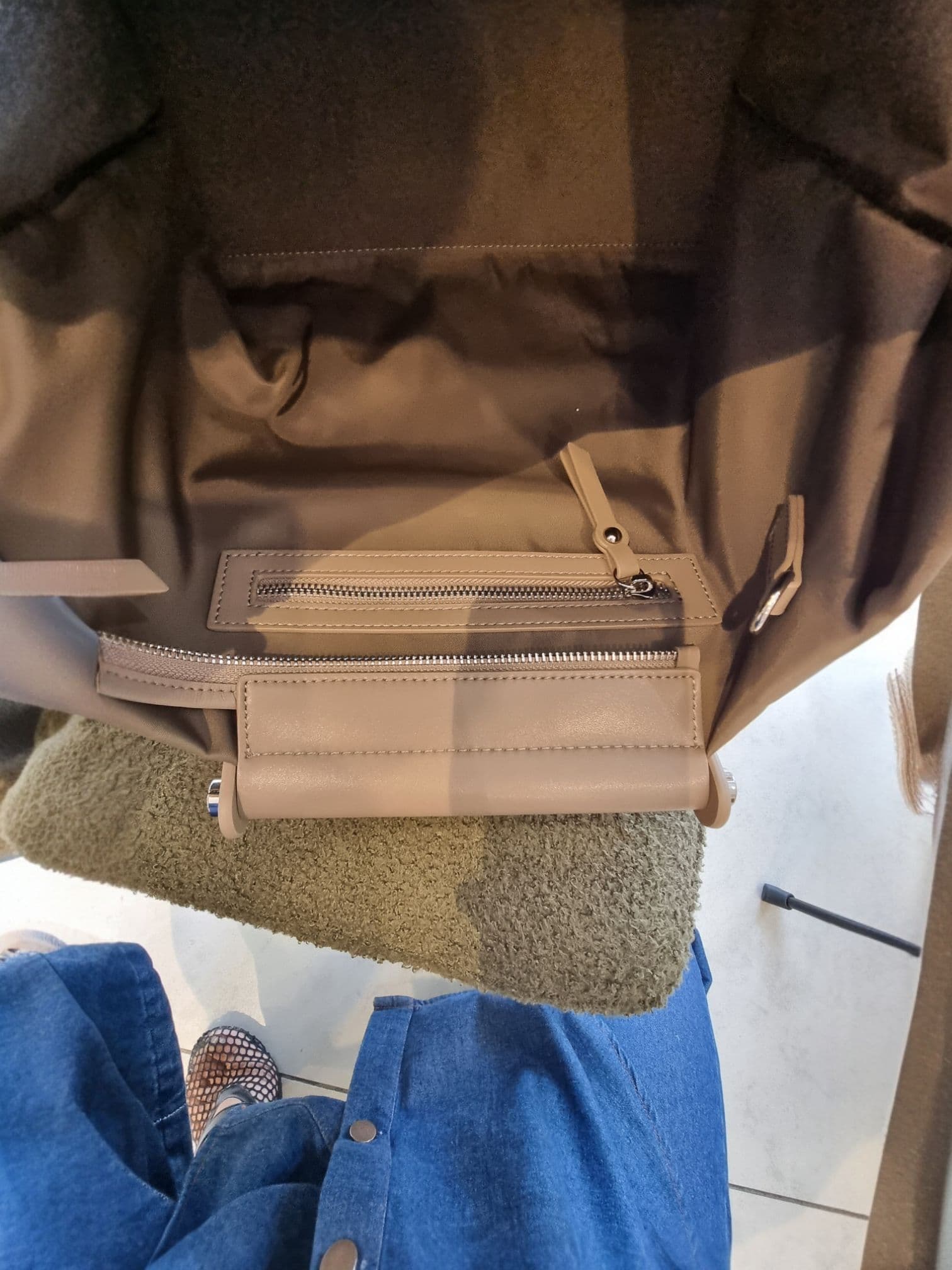 Close-up of the interior pocket and space inside EB brown bag.