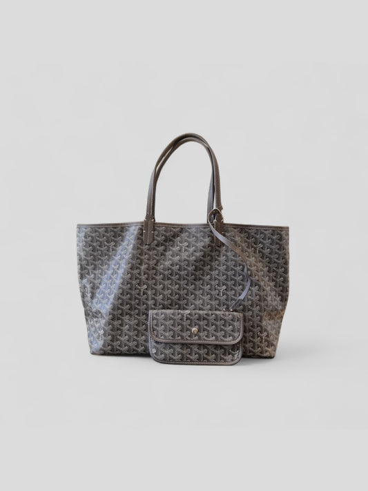Side angle of large grey patterned tote bag with dark handles