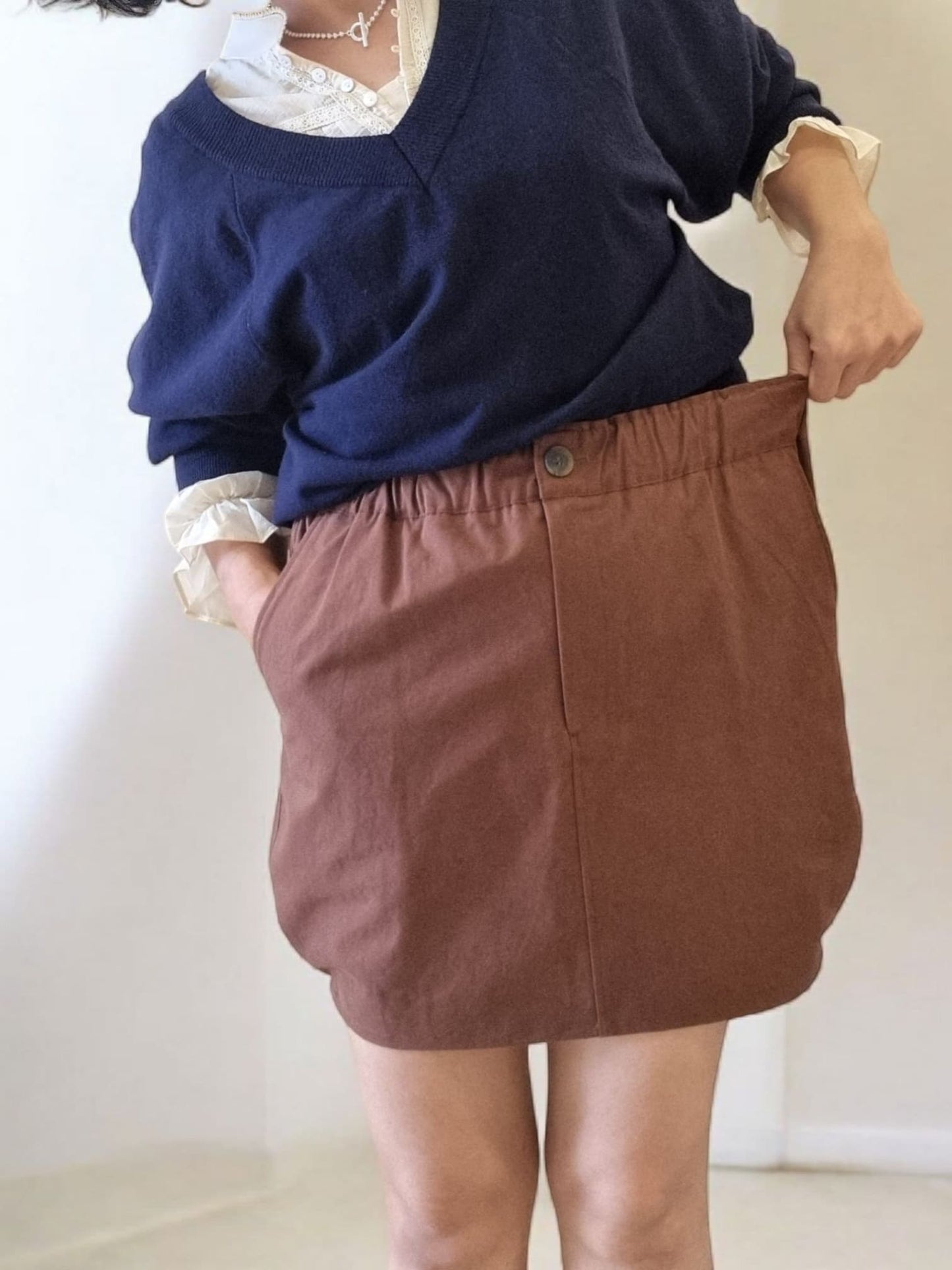 Front view of brown pumpkin skirt showing silhouette.