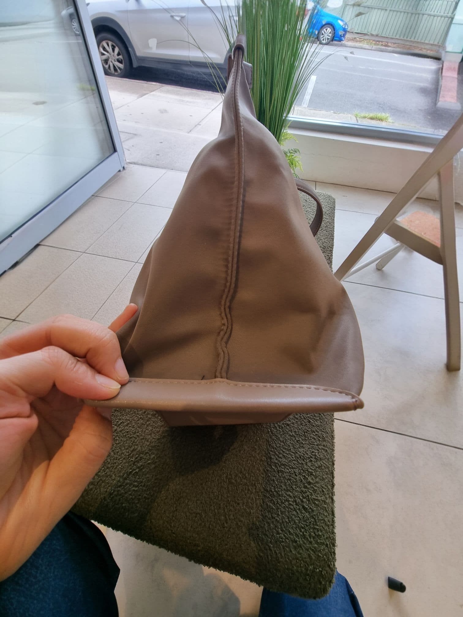 Rear angle of EB brown bag on display.
