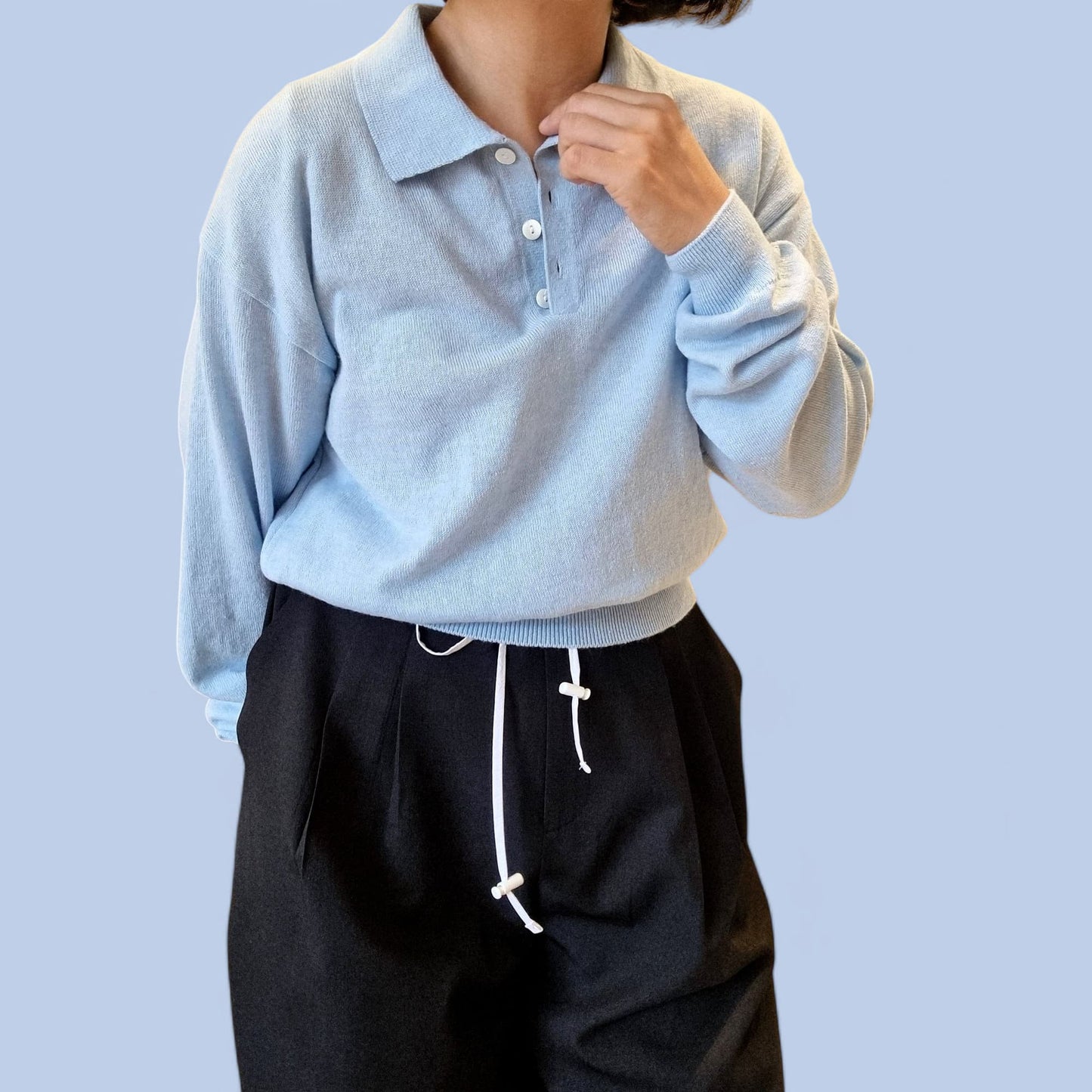“Close-up of blue cotton top with casual styling”