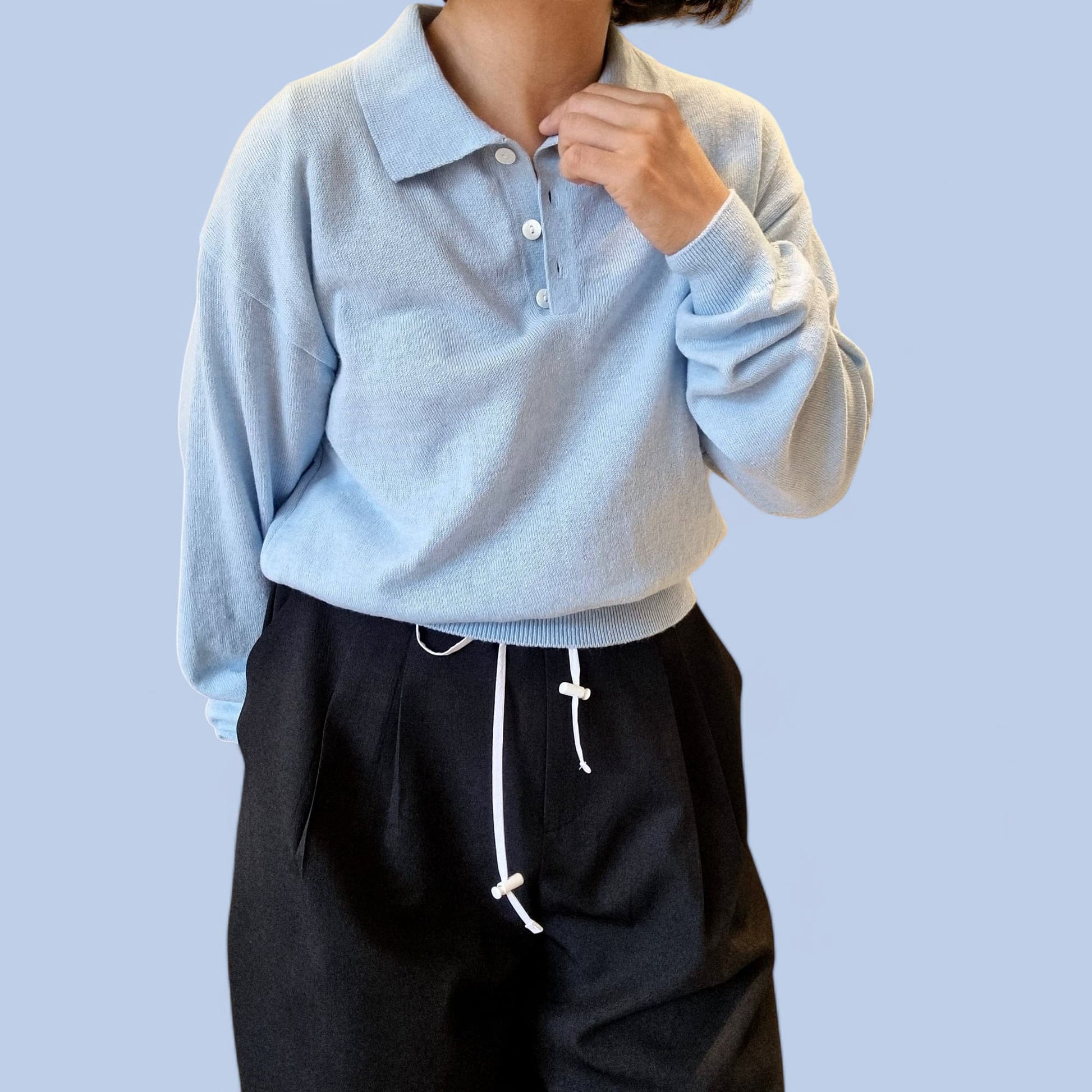 “Close-up of blue cotton top with casual styling”
