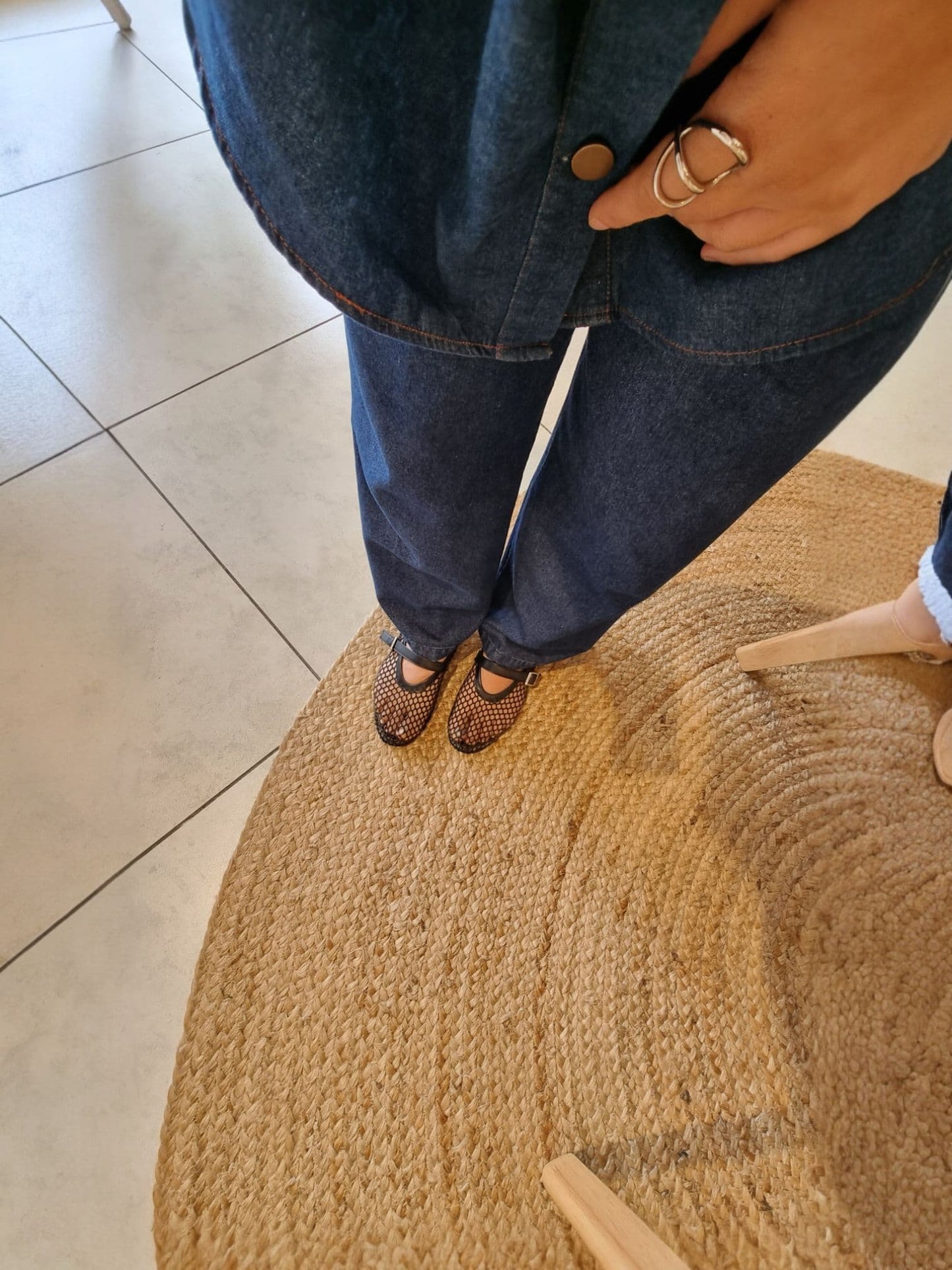 Black mesh Mary Jane flats full body view with grey shorts