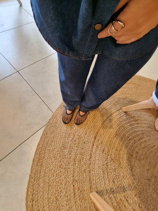 Black mesh Mary Jane flats full body view with grey shorts