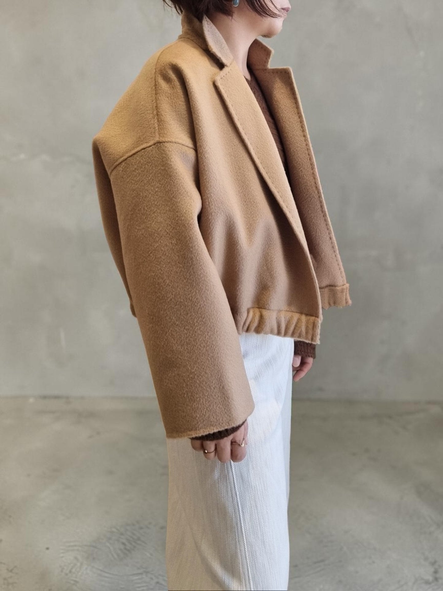 Minimalist camel wool jacket side profile
