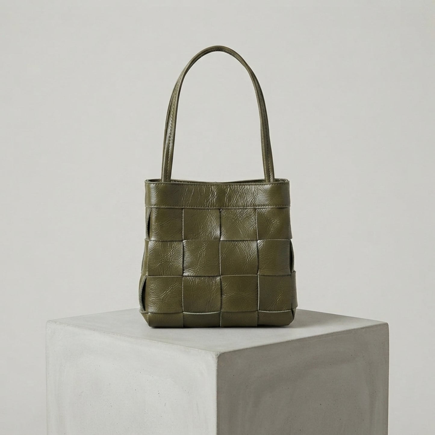 Olive green woven genuine leather handbag with top handles