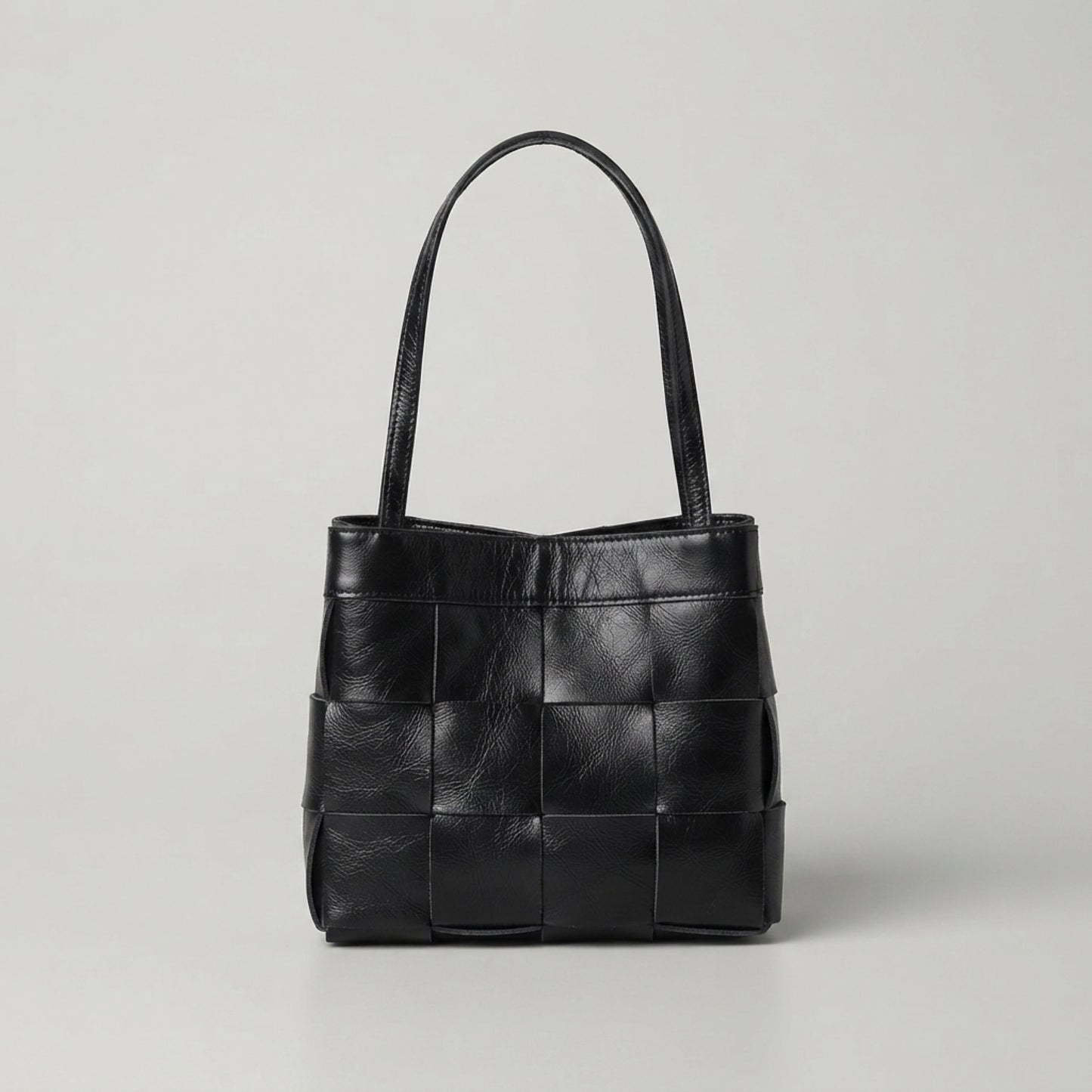 Black woven genuine leather handbag with top handles
