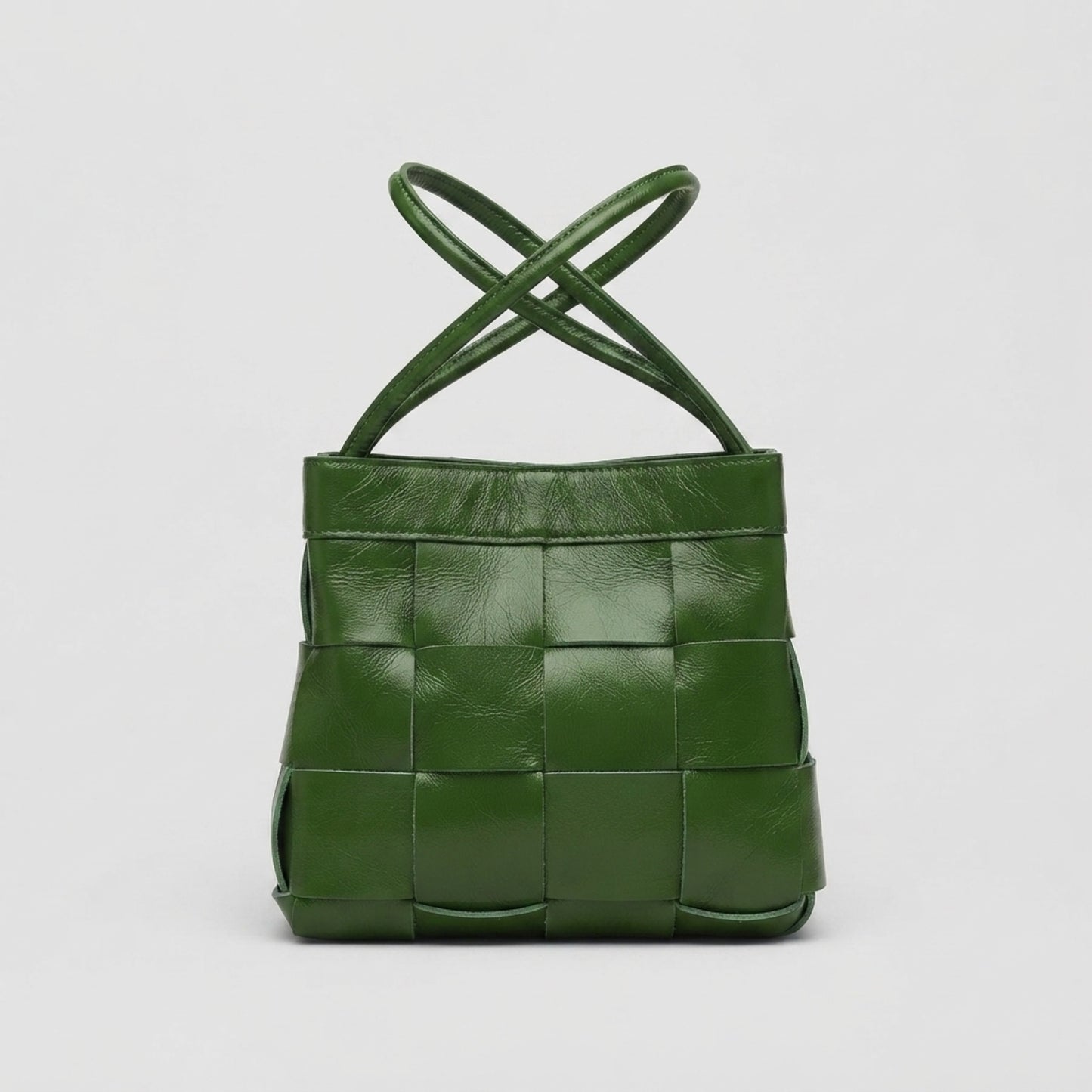 Green woven genuine leather crossbody bag with adjustable straps