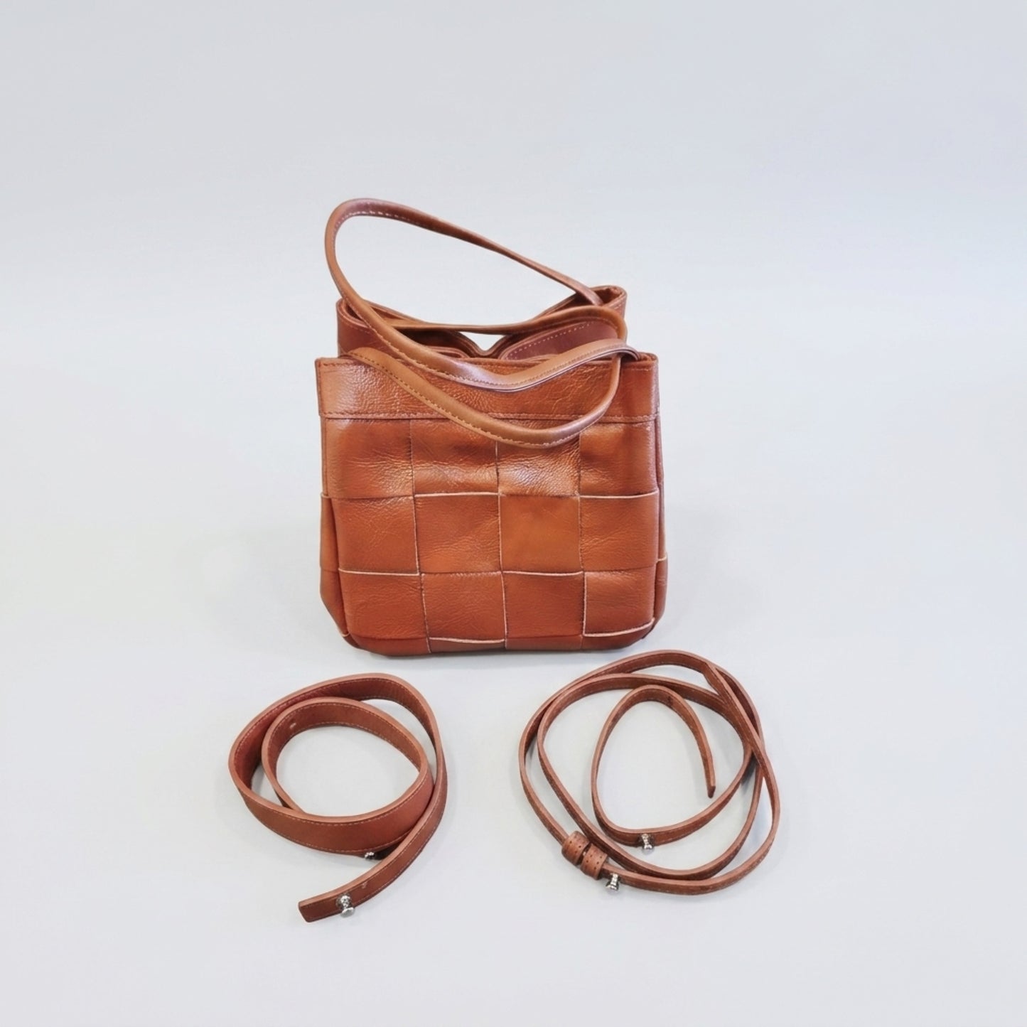 Brown woven leather bag with detachable and adjustable shoulder straps